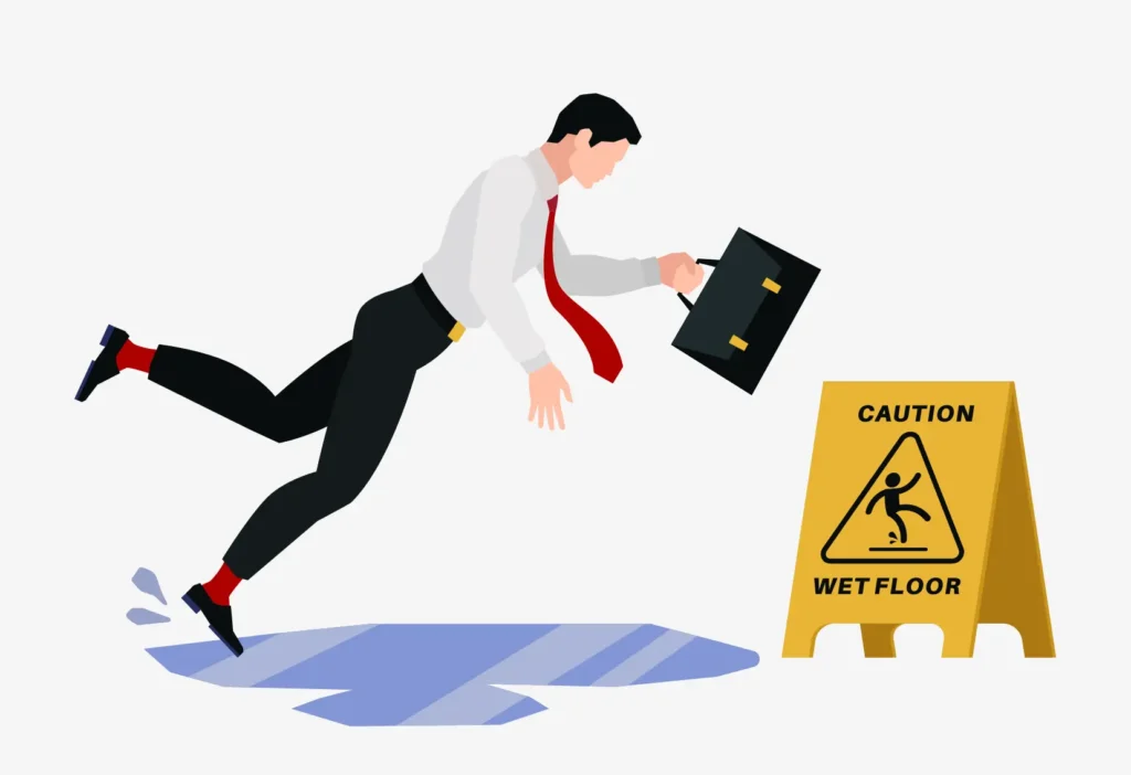 A graphic of a business man slipping in a puddle and falling near a caution sign.